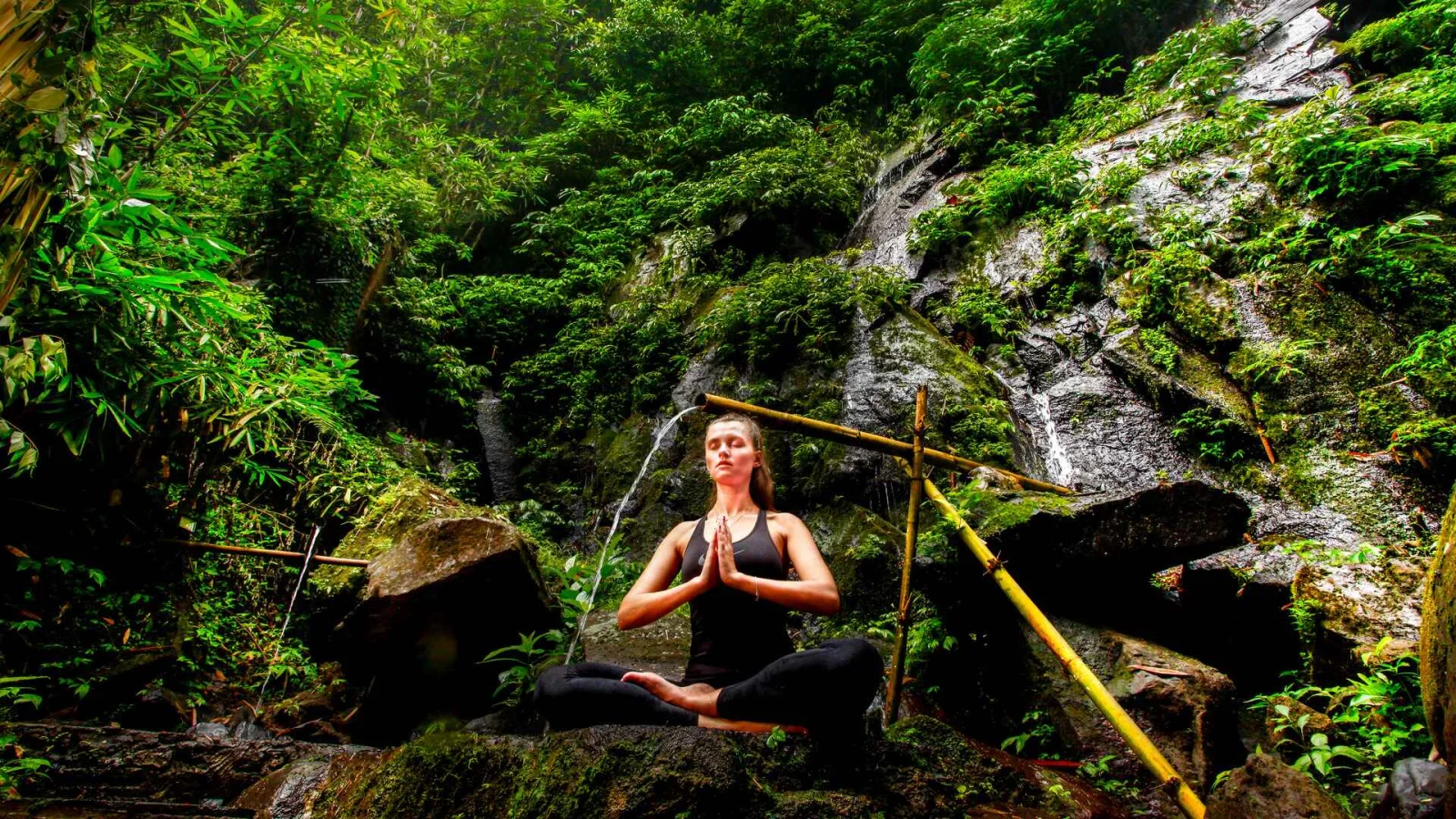 Guest meditating beside the Holy River at Nandini Jungle